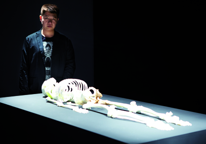 He Xiangyu alongside his work, Skeleton at 4A Centre for Contemporary Asian Art
