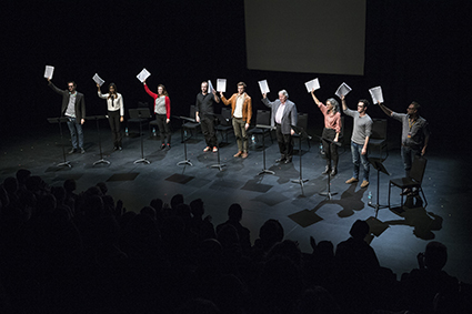 Actors ‘take a bow’ for the playwright by holding scripts aloft