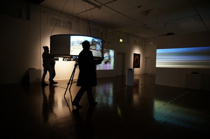 Volker Kuchelmeister, foreground Juxtaposition, 2010, Interactive video installation, background: A dromological vision machine, 2013, Interactive video installation